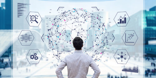 Man looking at an illustration of a complex network