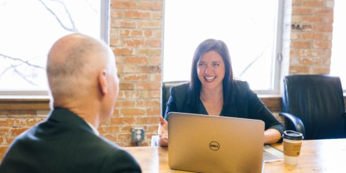 two coworkers discussing sales qualified leads