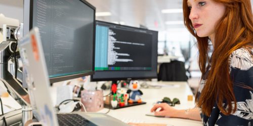 woman working at computer with predictive lead scoring