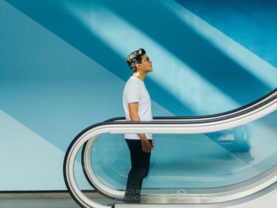 Person riding escalator symbolizing someone at the start of implementing AI/ML tools